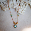 Collier UBIKA avec cordon Orangé avec Turquoise, trèfle en Labradorite doré à l'or fin et Hématite