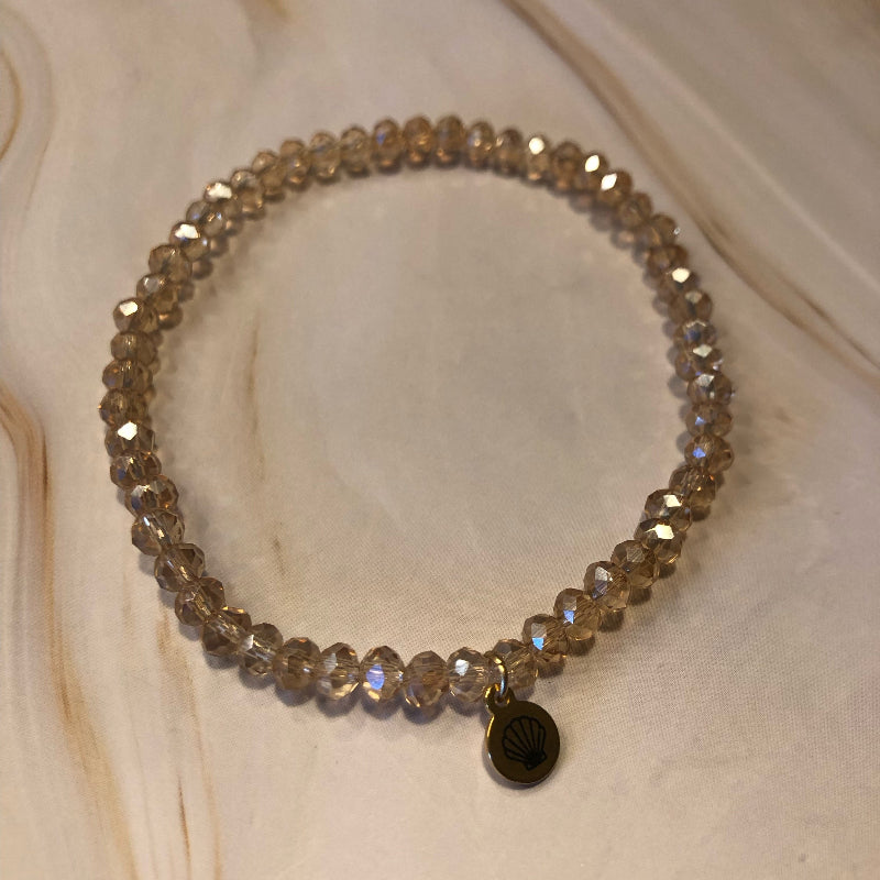 Bracelet with sparkling faceted glass beads with golden reflections